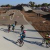 A group of young BMX enthusiasts make the turn in one of many "motos" held this past weekend at the Lemoore BMX Raceway.